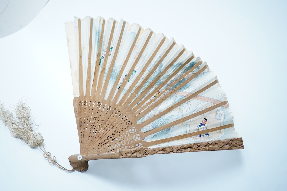A collection of 19th century and later fans to include a black lacquered and lace example and a hand painted floral example